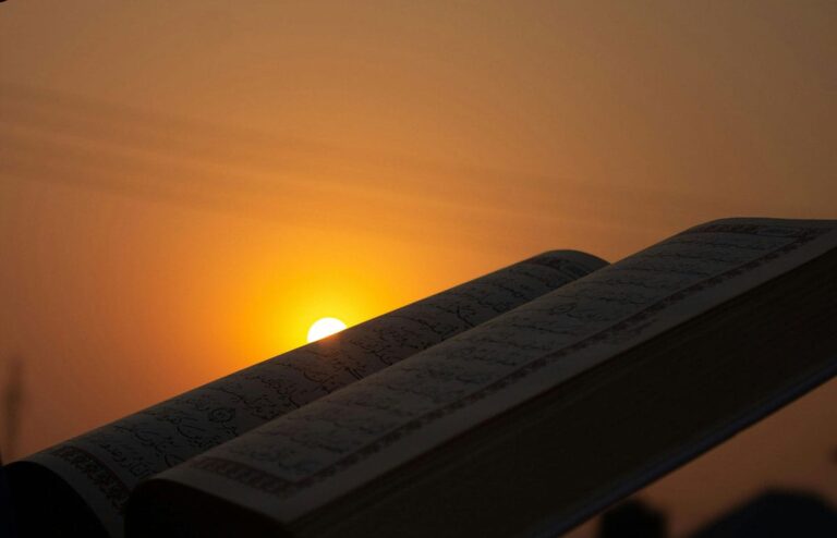 with the sun setting behind it. Konsep Cahaya Menurut Al-Qur’an dan Ilmu Fisika